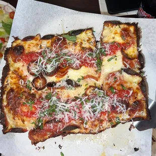 Rectangle pizza with pepperoni (ordered banana rings and hot honey but got the wrong pizza)