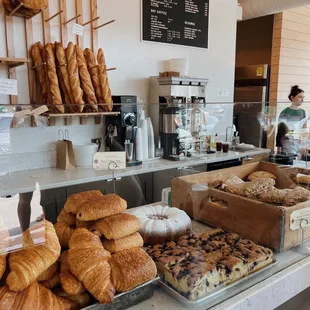 a bakery counter full of baked goods