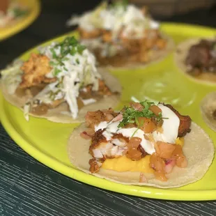 tacos on a yellow plate