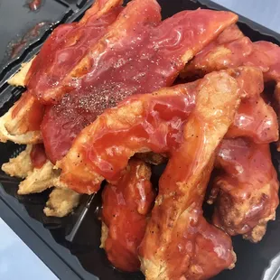 bacon and eggs in a black container