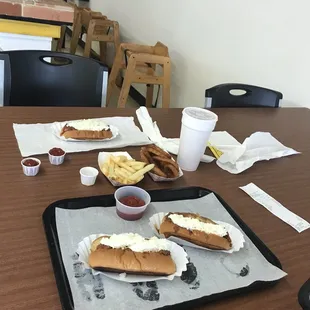 Hotdogs, fries onion ring.