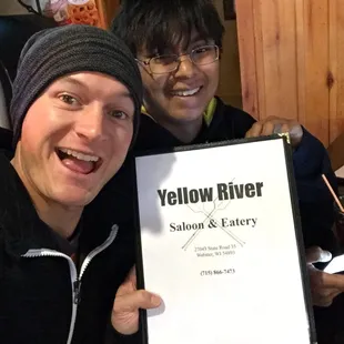 two men holding a sign