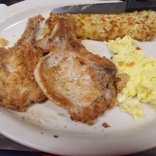 a plate of food with a knife and fork