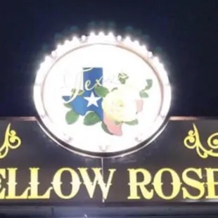 the sign for the yellow rose saloon