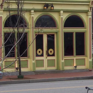 a bicycle parked in front of the building