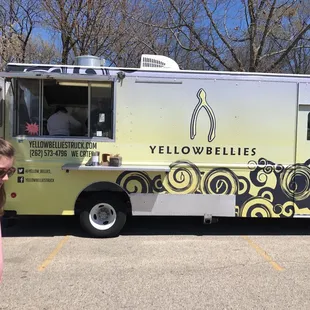 a woman walking in front of it