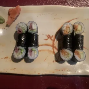 Salmon and tuna rolls with avocado and cucumber