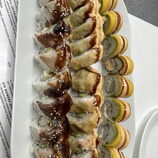 3 rolls - CHILANGO ROLL (with mango), EL DORADO ROLL (middle), and DRAGON ROLL (brown sauce)