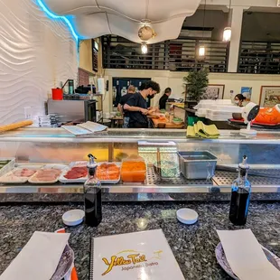 a restaurant counter with food on it