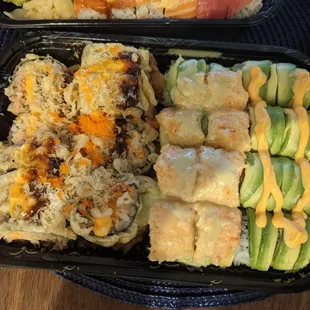 two trays of food on a table