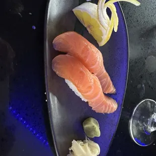 Two pieces of HH salmon nigiri. $4 each.