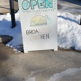 a sign on the sidewalk
