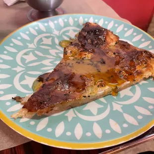 a slice of pizza on a plate