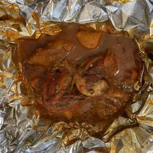 a piece of meat wrapped in foil