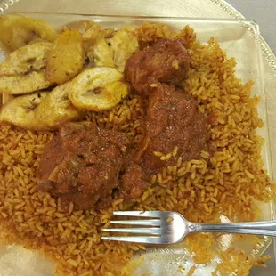 Chicken with jollof rice and fried plantain. SUPER YUMMY