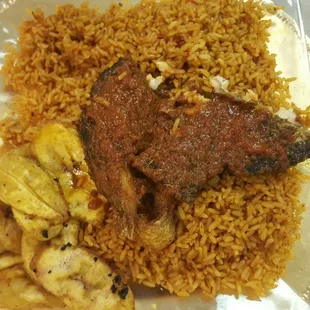 Fish with jollof rice and fried plantain. YUMMY