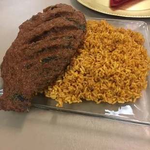 whole tilapia and jollof rice