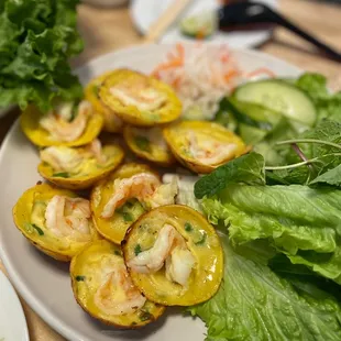 Mini turmeric pancakes. Amazing batter (it's the banh xeo batter). No where else in the city serves this dish (as far as I know).