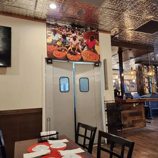 Yendidi's kitchen lies behind those double doors.