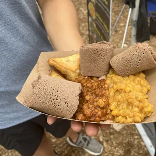 person holding a tray of food