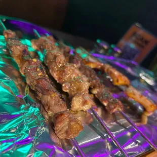 Lamb and squid skewers