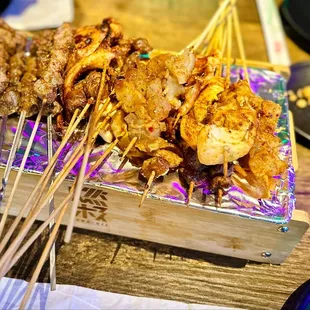 Chicken gizzards, tendons, cows throat, beef and lamb, pig intestines, squid and squid tentacles.