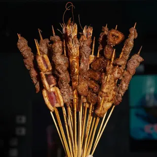 a hand holding skews of skews