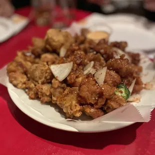 a plate of food on a red table