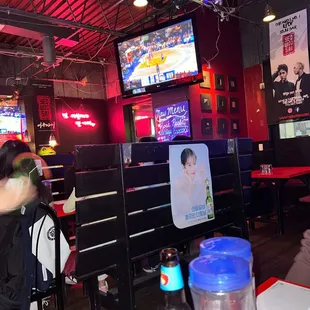 a person sitting at a table in a restaurant