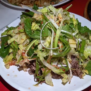 Scallion salad with sliced brisket