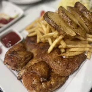 a plate of meat and french fries