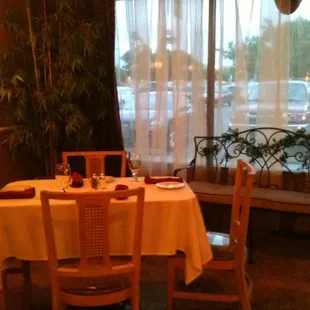 a dining room with a table and chairs