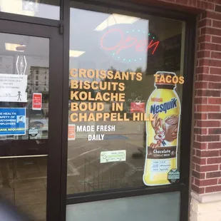 a sign in the window of a restaurant