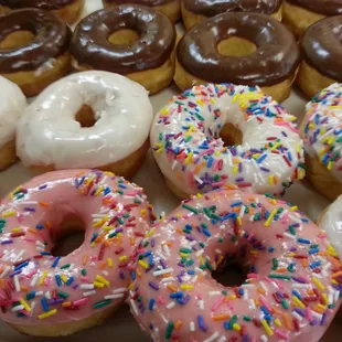 a variety of donuts with sprinkles