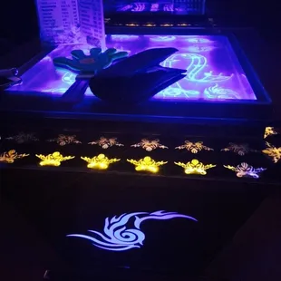 a glowing table with a lighted table top