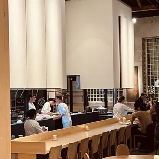 people sitting at tables in a restaurant