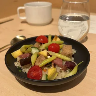a plate of food and a glass of water