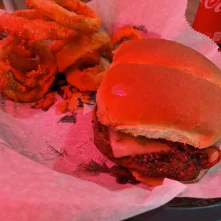 Bacon cheese burger with onion rings.