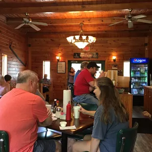 a group of people sitting at a table