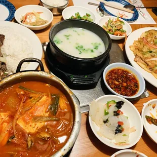 Military stew (front left), bulgogi over rice (back left), ox tail soup (middle), seafood pancake (right), along with side dishes!