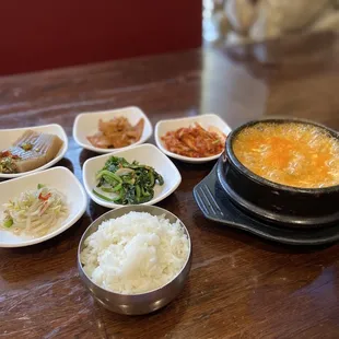 a variety of bowls of food on a table