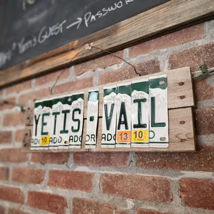 a sign on a brick wall