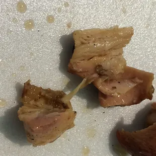 a piece of meat on a white plate