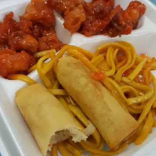 Genera Tso's Chicken with Noodles and Egg Rolls.