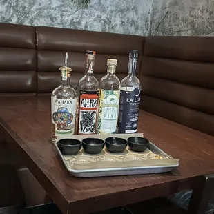 a tray of liquors on a table