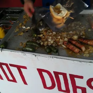 Bacon wrapped hot dogs outside!