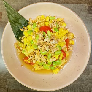 Tum Khao Pod (Corn Salad) spicy corn salad with tomato, edamame, peanut