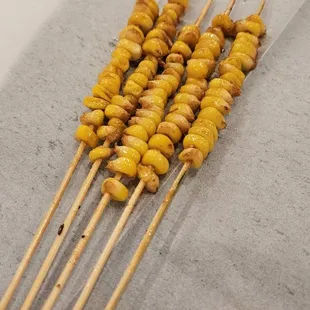 Corn skewers.  I was fascinated with the time they took to actually skewer the kernels