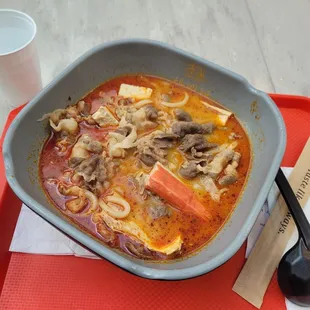 a bowl of soup on a tray