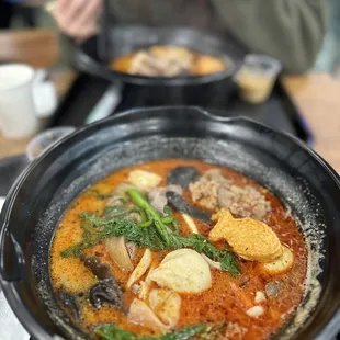 a person eating a bowl of soup